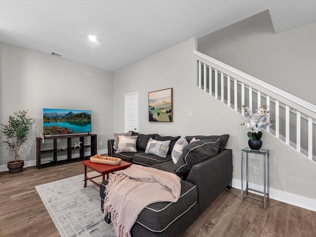 living room with dark hardwood / wood-style floors