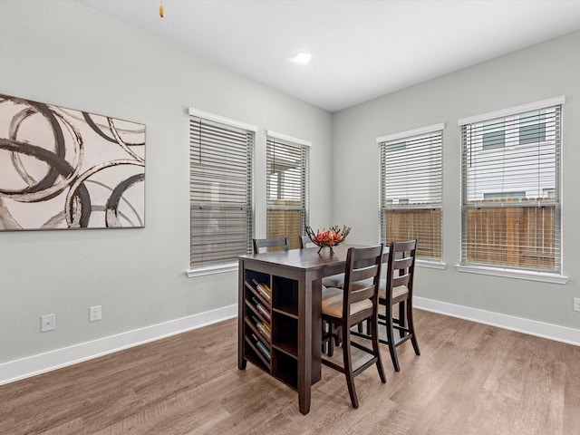 dining space featuring hardwood / wood-style flooring