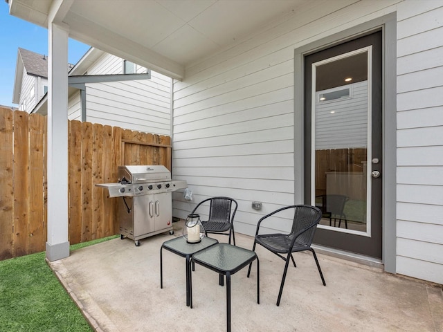 view of patio featuring a grill