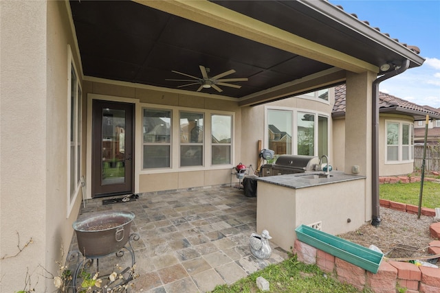 18111 Dockside Landing Dr, Cypress, TX 77433 - view of patio / terrace with exterior kitchen, ceiling fan, a sink, a grill, and fence