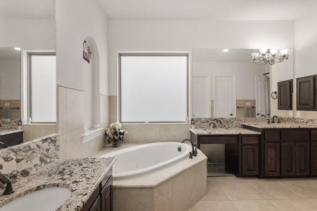 18111 Dockside Landing Dr, Cypress, TX 77433 - full bathroom with a whirlpool tub, two vanities, and tile patterned flooring