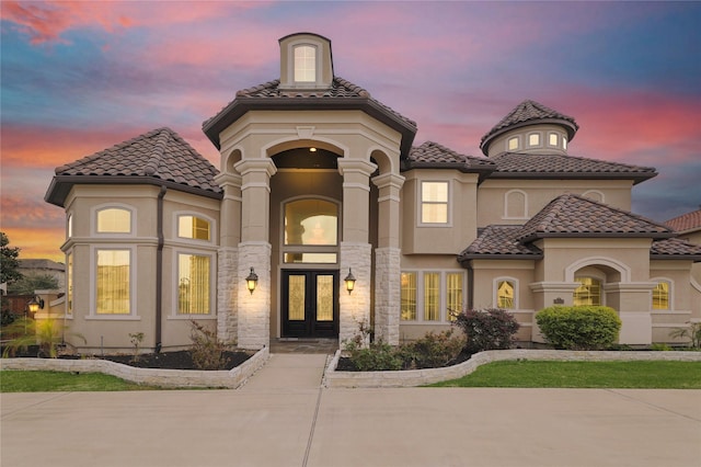 18111 Dockside Landing Dr, Cypress, TX 77433 - view of front of home featuring french doors, a tile roof, stucco siding, and stone siding