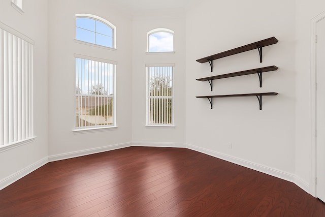 18111 Dockside Landing Dr, Cypress, TX 77433 - unfurnished room with dark wood finished floors, baseboards, and a high ceiling