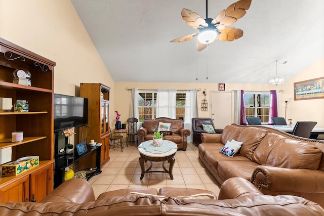 living room featuring ceiling fan, high vaulted ceiling, and light tile patterned floors