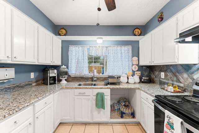 kitchen with white cabinetry, sink, and electric stove