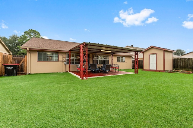 rear view of property featuring a storage shed, a yard, and a patio