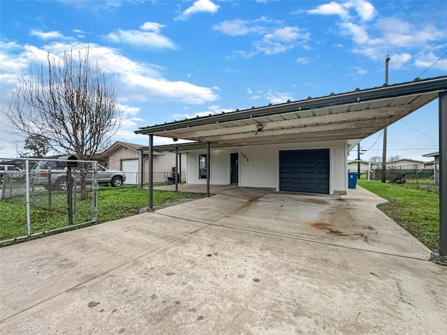 view of front of house with a garage, a front lawn, and fence