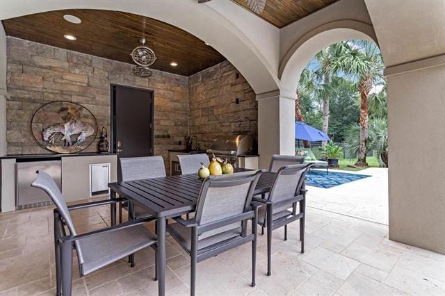 view of patio with an outdoor kitchen