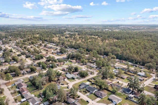 birds eye view of property featuring a residential view and a view of trees