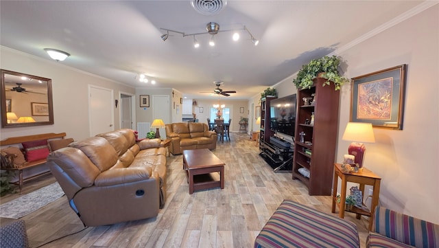 living room featuring light hardwood / wood-style flooring, ornamental molding, ceiling fan, and track lighting