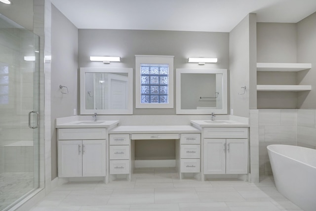 bathroom with vanity and separate shower and tub