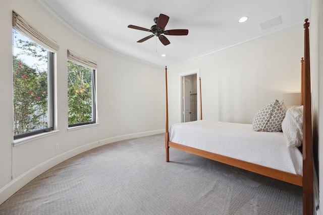 bedroom featuring ornamental molding, carpet floors, and ceiling fan