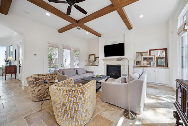 living room with beamed ceiling, coffered ceiling, ceiling fan, and french doors