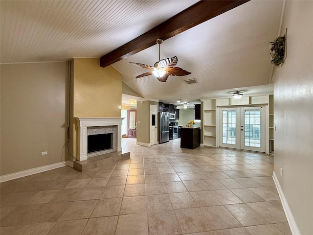 unfurnished living room with light tile patterned flooring, vaulted ceiling with beams, ceiling fan, and french doors