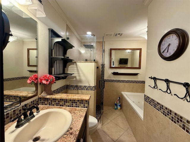 full bathroom featuring tile patterned floors, ornamental molding, independent shower and bath, and toilet