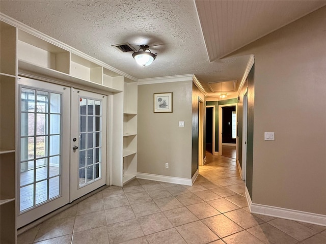 interior space featuring crown molding, light tile patterned floors, a textured ceiling, and french doors