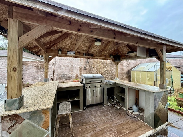 view of patio / terrace featuring grilling area and exterior bar