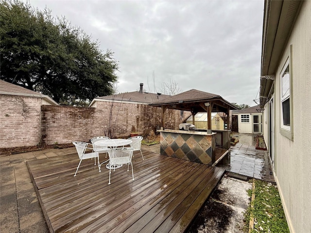 wooden terrace with a gazebo