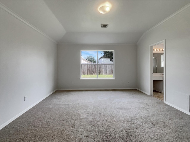 unfurnished bedroom featuring carpet floors, baseboards, and ornamental molding