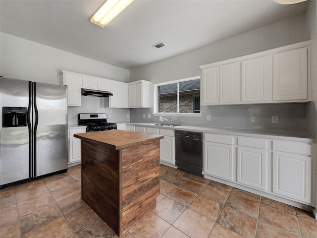 kitchen with under cabinet range hood, white cabinetry, appliances with stainless steel finishes, and light countertops