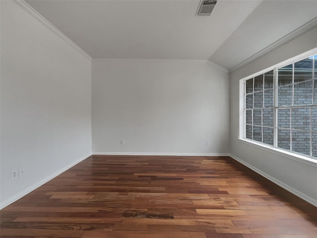 empty room with dark wood-style floors, lofted ceiling, visible vents, and baseboards