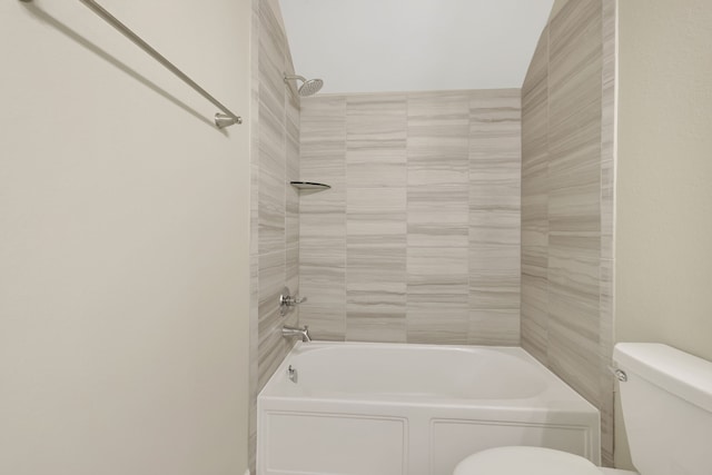 bathroom featuring bathtub / shower combination and toilet