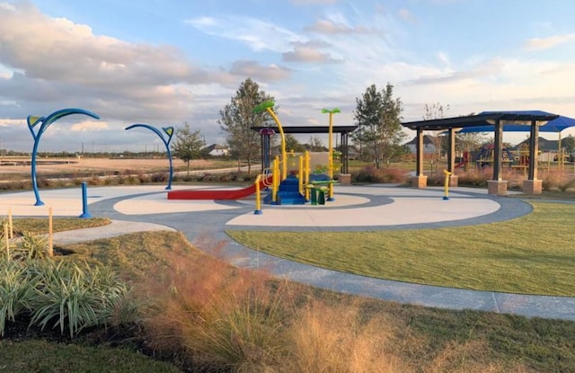 community play area featuring a lawn