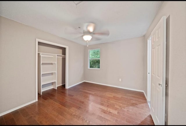 unfurnished bedroom with ceiling fan, hardwood / wood-style floors, and a closet