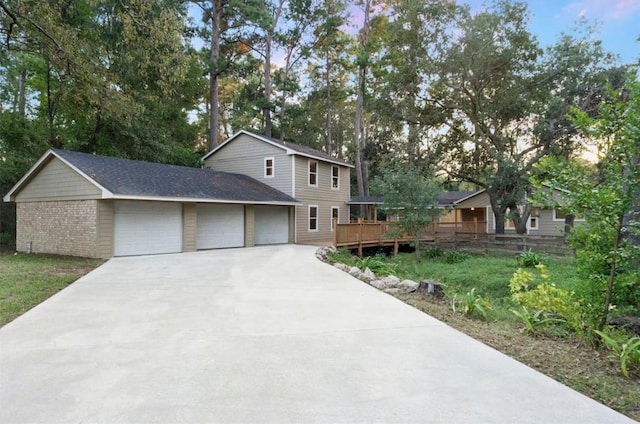 view of front facade featuring a garage and a deck