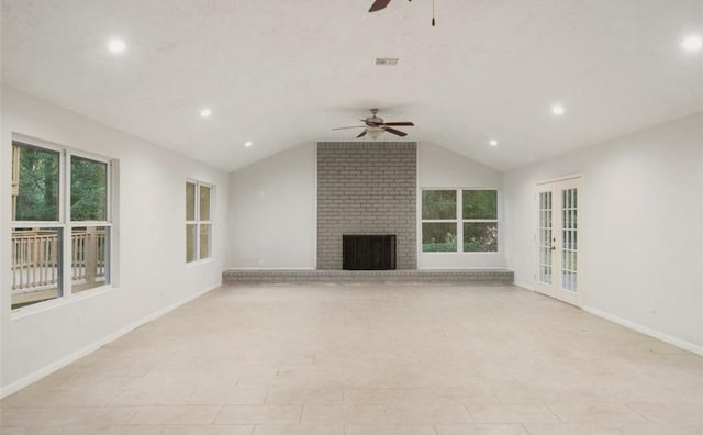 unfurnished living room featuring ceiling fan, vaulted ceiling, and a brick fireplace