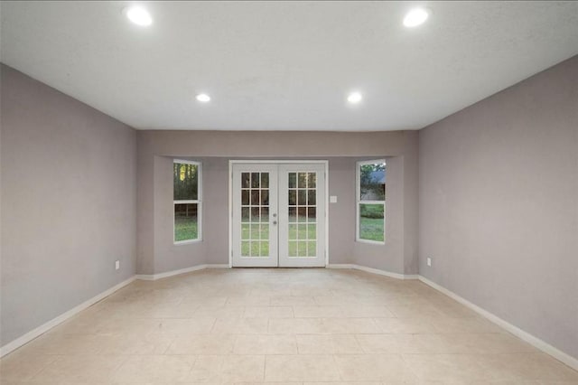 spare room featuring french doors