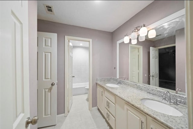 bathroom with vanity, tile patterned flooring, and toilet