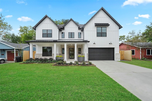 8545 Ridgepoint Dr, Houston, TX 77055 - modern farmhouse with a garage, driveway, a standing seam roof, board and batten siding, and metal roof