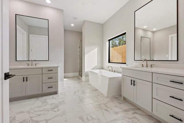 8545 Ridgepoint Dr, Houston, TX 77055 - full bath with a bath, marble look tile flooring, a stall shower, two vanities, and recessed lighting