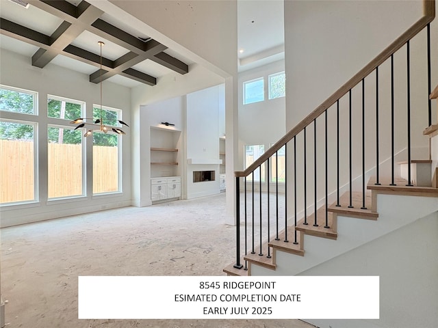 8545 Ridgepoint Dr, Houston, TX 77055 - stairway with a high ceiling, beam ceiling, and coffered ceiling