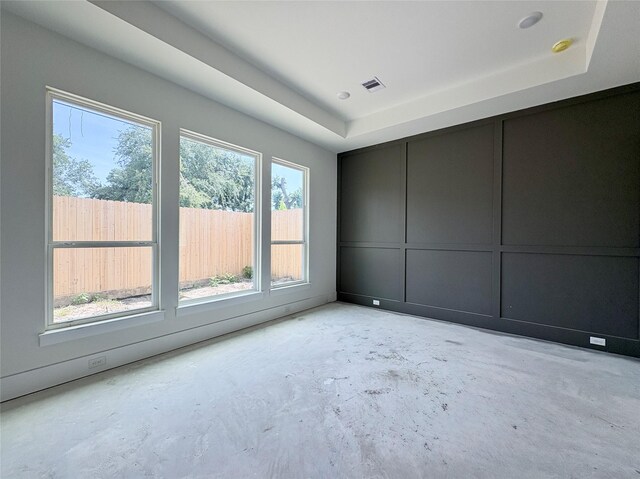8545 Ridgepoint Dr, Houston, TX 77055 - unfurnished room with unfinished concrete floors, a raised ceiling, and a smoke detector