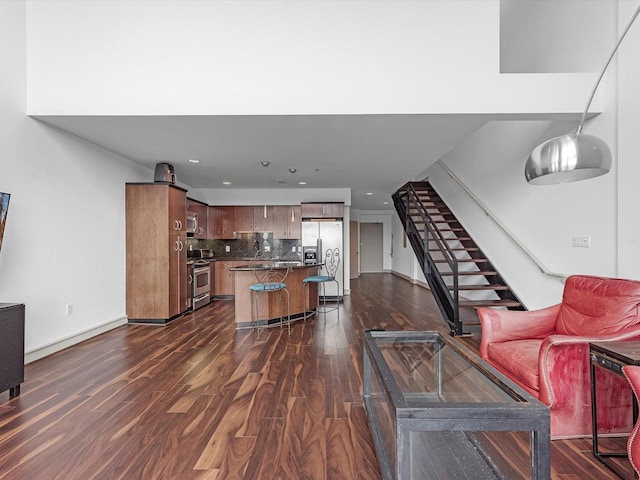 living room featuring dark wood-type flooring