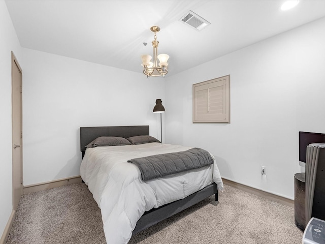 bedroom with a notable chandelier