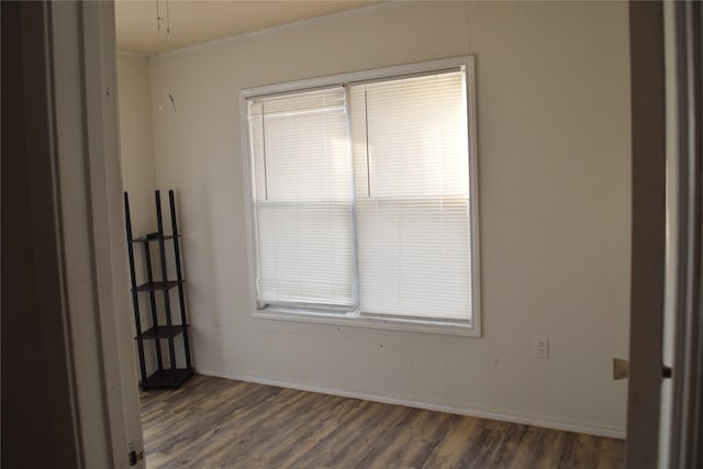 spare room featuring dark hardwood / wood-style floors