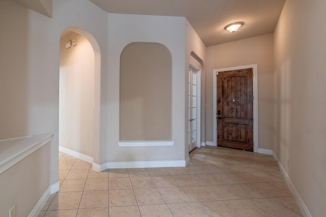 entryway featuring light tile patterned flooring