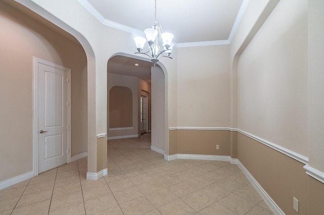 unfurnished dining area with ornamental molding, light tile patterned floors, and an inviting chandelier