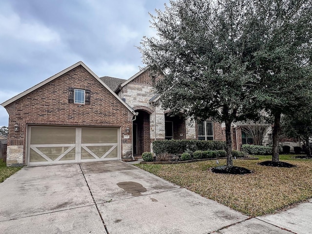 view of front of home with a garage and a front yard