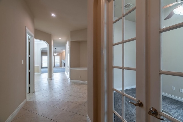 hallway featuring light tile patterned floors