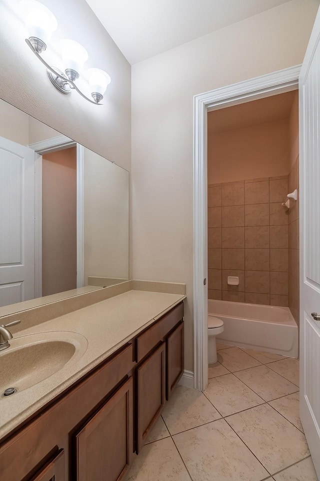 full bathroom with vanity, toilet, tiled shower / bath combo, and tile patterned flooring