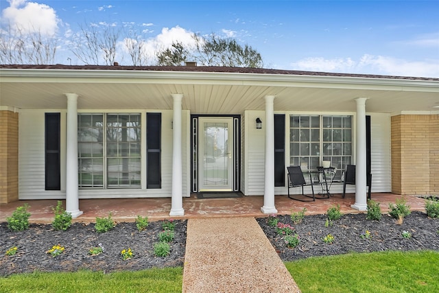 doorway to property featuring a porch