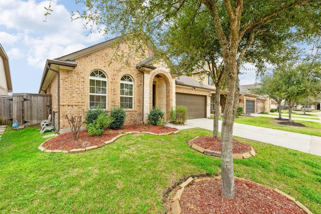 view of front of home featuring a garage and a front lawn