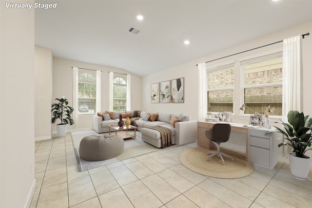 tiled living room featuring vaulted ceiling