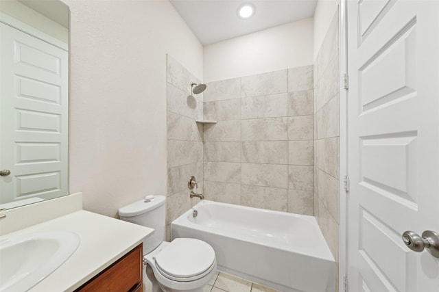 full bathroom featuring vanity, tiled shower / bath combo, tile patterned floors, and toilet