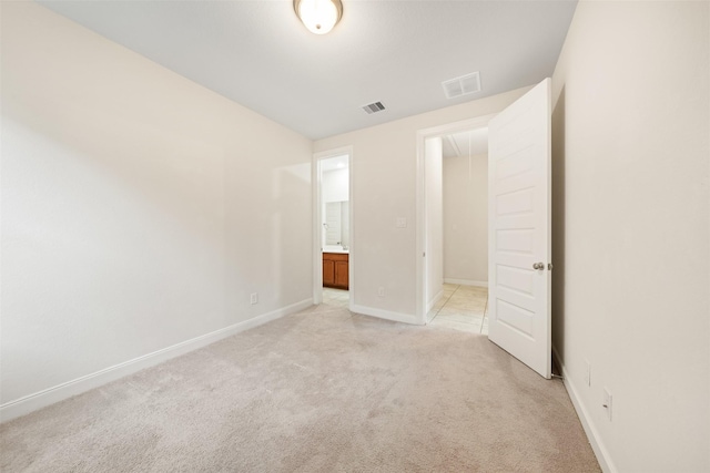 unfurnished bedroom with light carpet