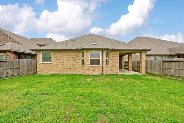 back of property featuring a yard and a patio